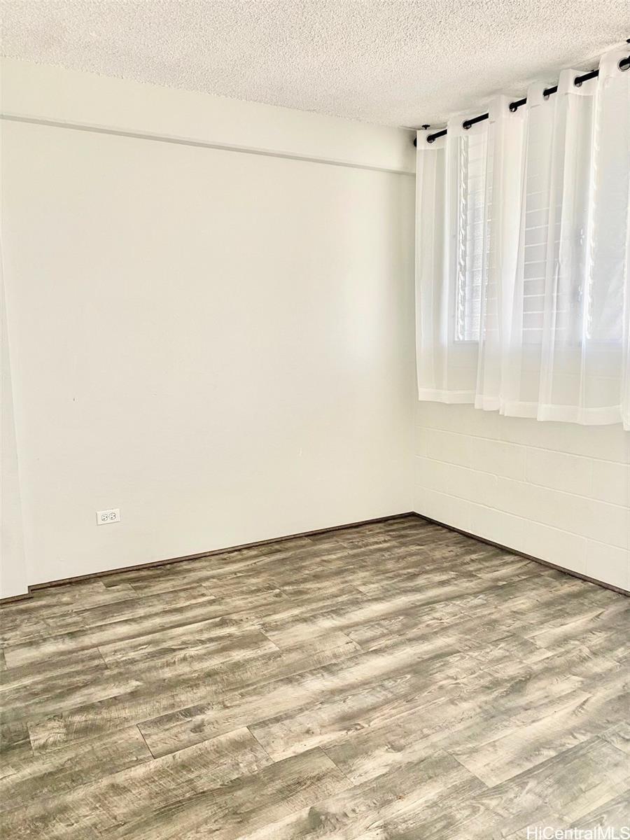 99-70 Kauhale Street, Unit 606 Aiea, HI 96701 - Photo 8 of 8 a view of an empty room with a window