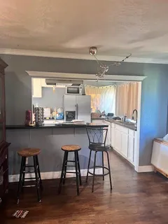 a kitchen with a table and chairs in it