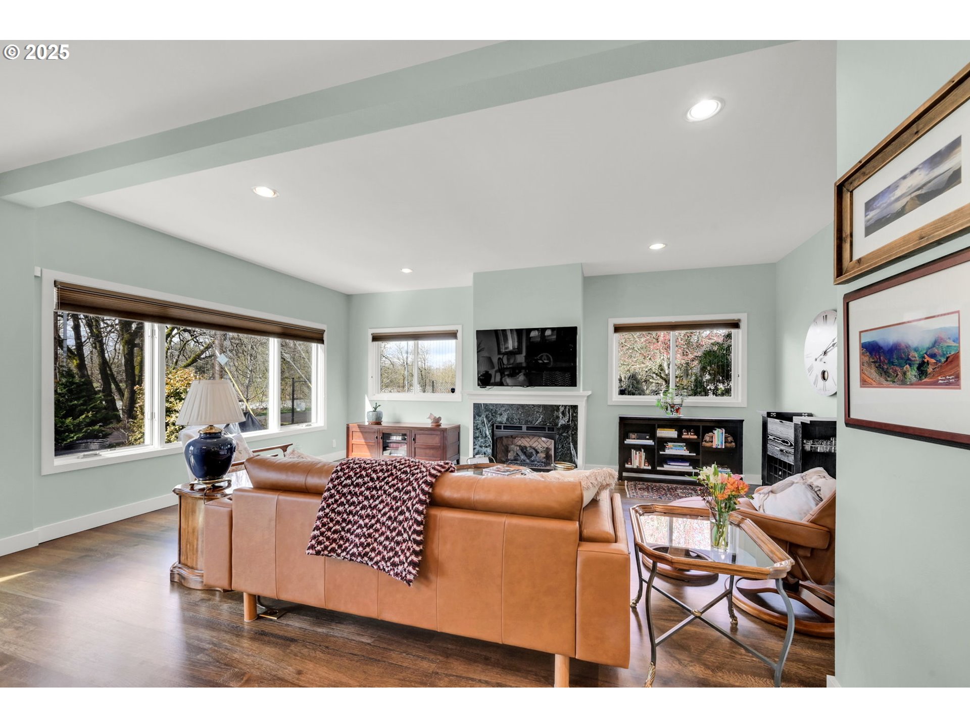 579 Wimbledon Court Eugene, OR 97401 - Photo 12 of 46 a living room with furniture a flat screen tv and a large window