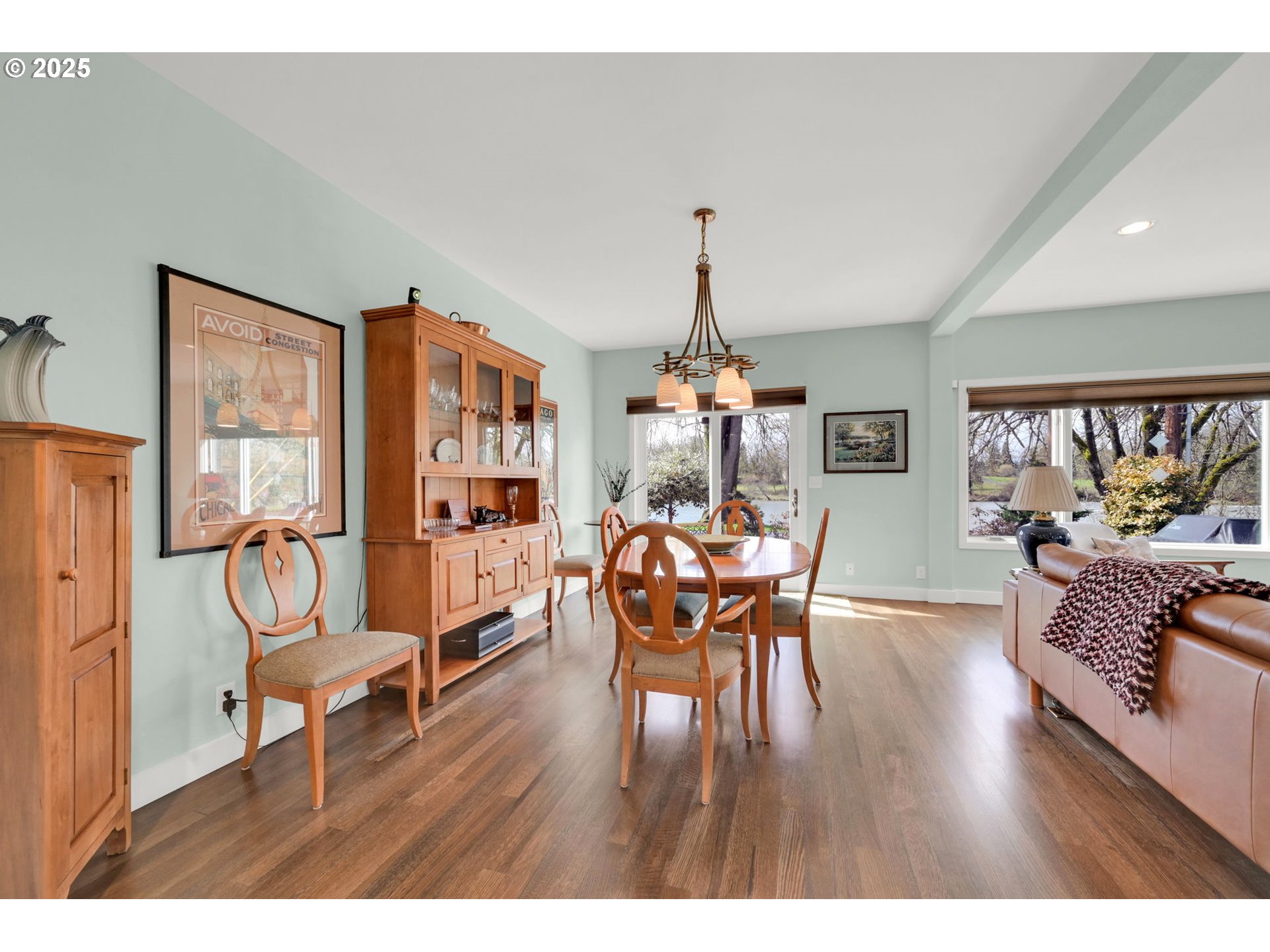 579 Wimbledon Court Eugene, OR 97401 - Photo 23 of 46 a dining room with furniture a chandelier and wooden floor