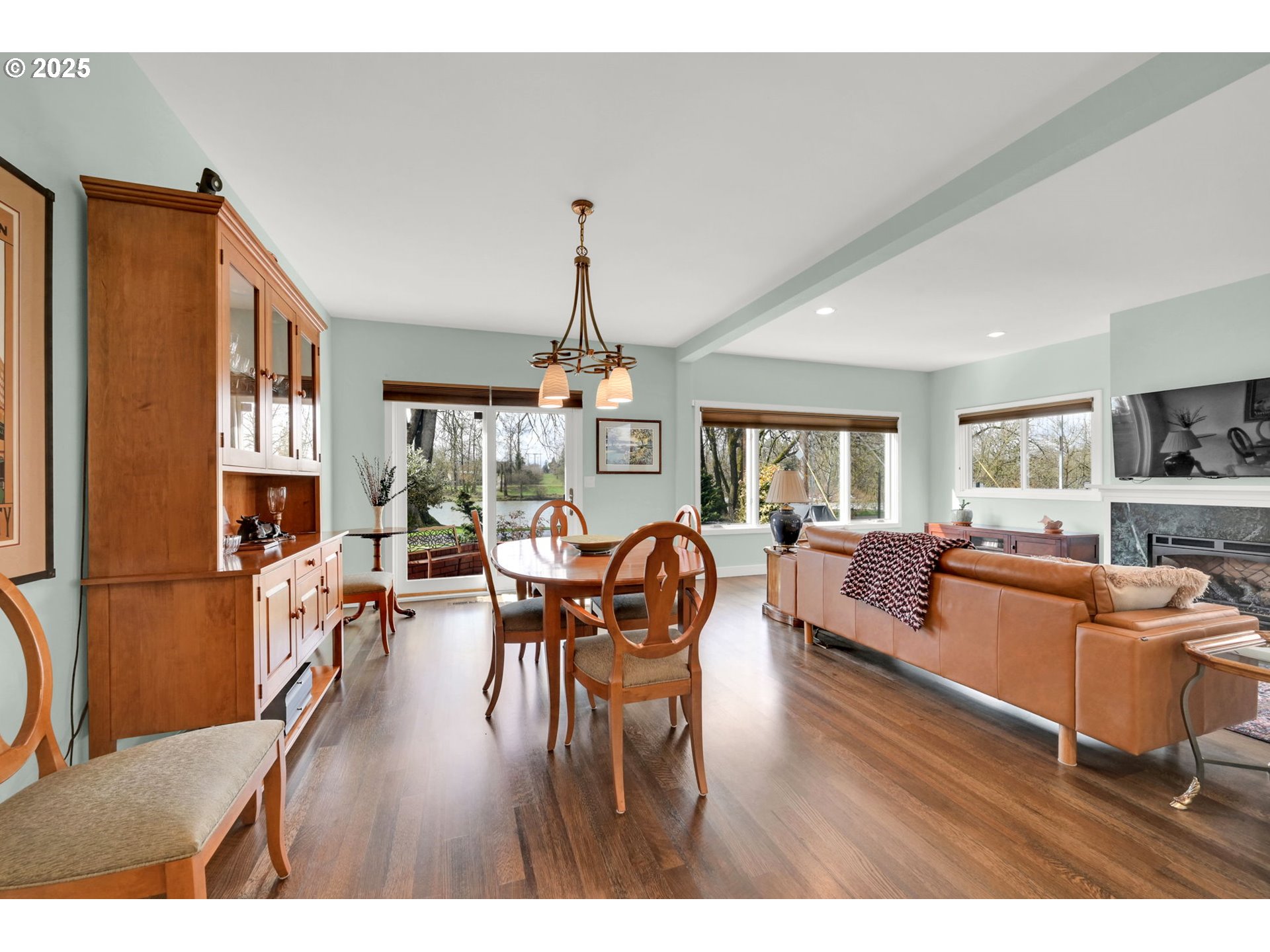 579 Wimbledon Court Eugene, OR 97401 - Photo 24 of 46 a living room with furniture dining table and a refrigerator