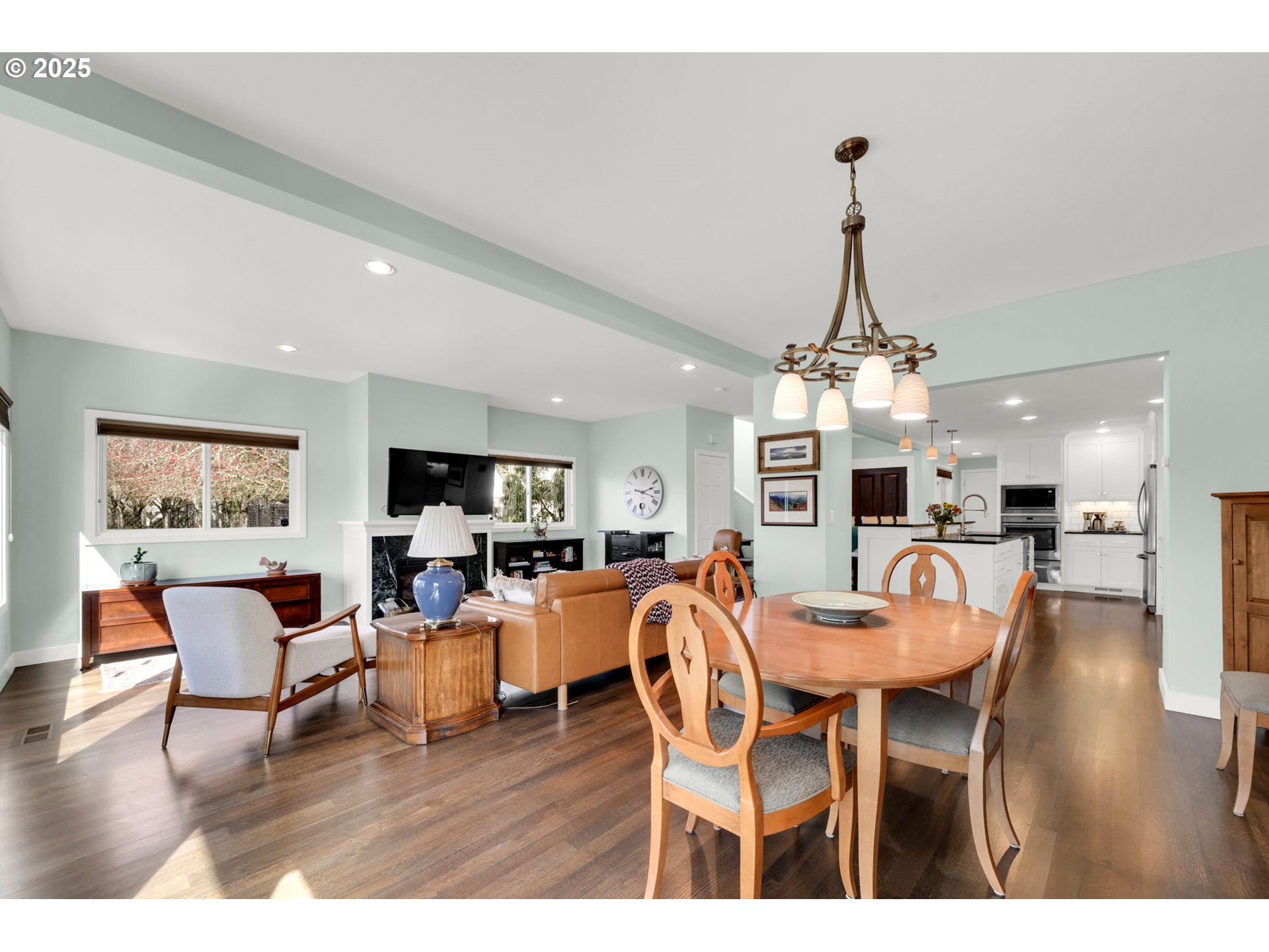 579 Wimbledon Court Eugene, OR 97401 - Photo 26 of 46 a view of a dining room with furniture wooden floor and chandelier