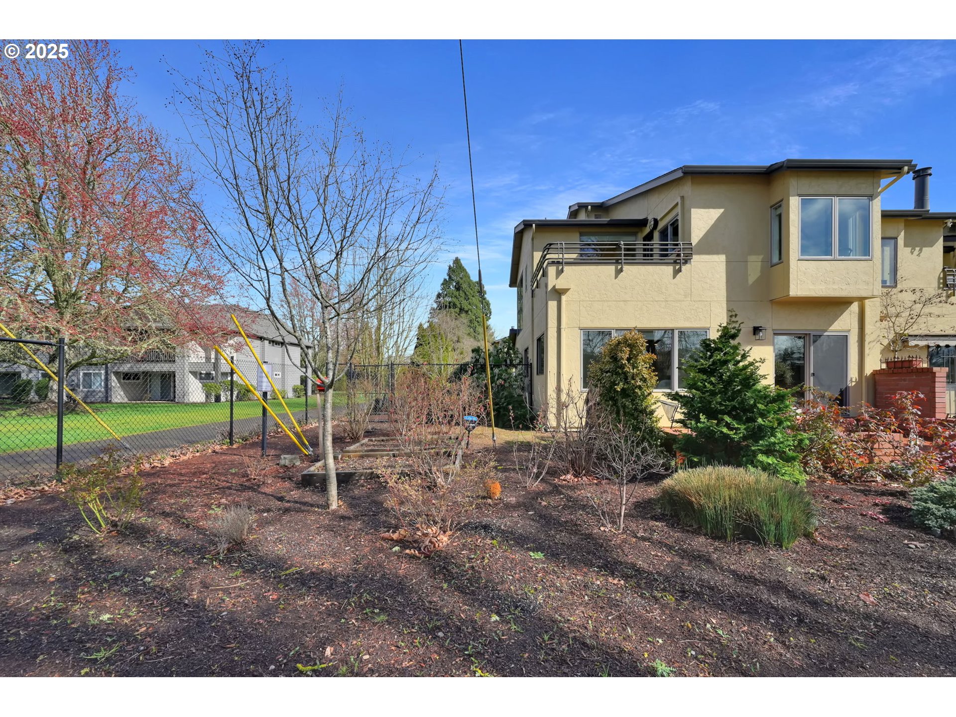 579 Wimbledon Court Eugene, OR 97401 - Photo 42 of 46 a view of a house with a backyard