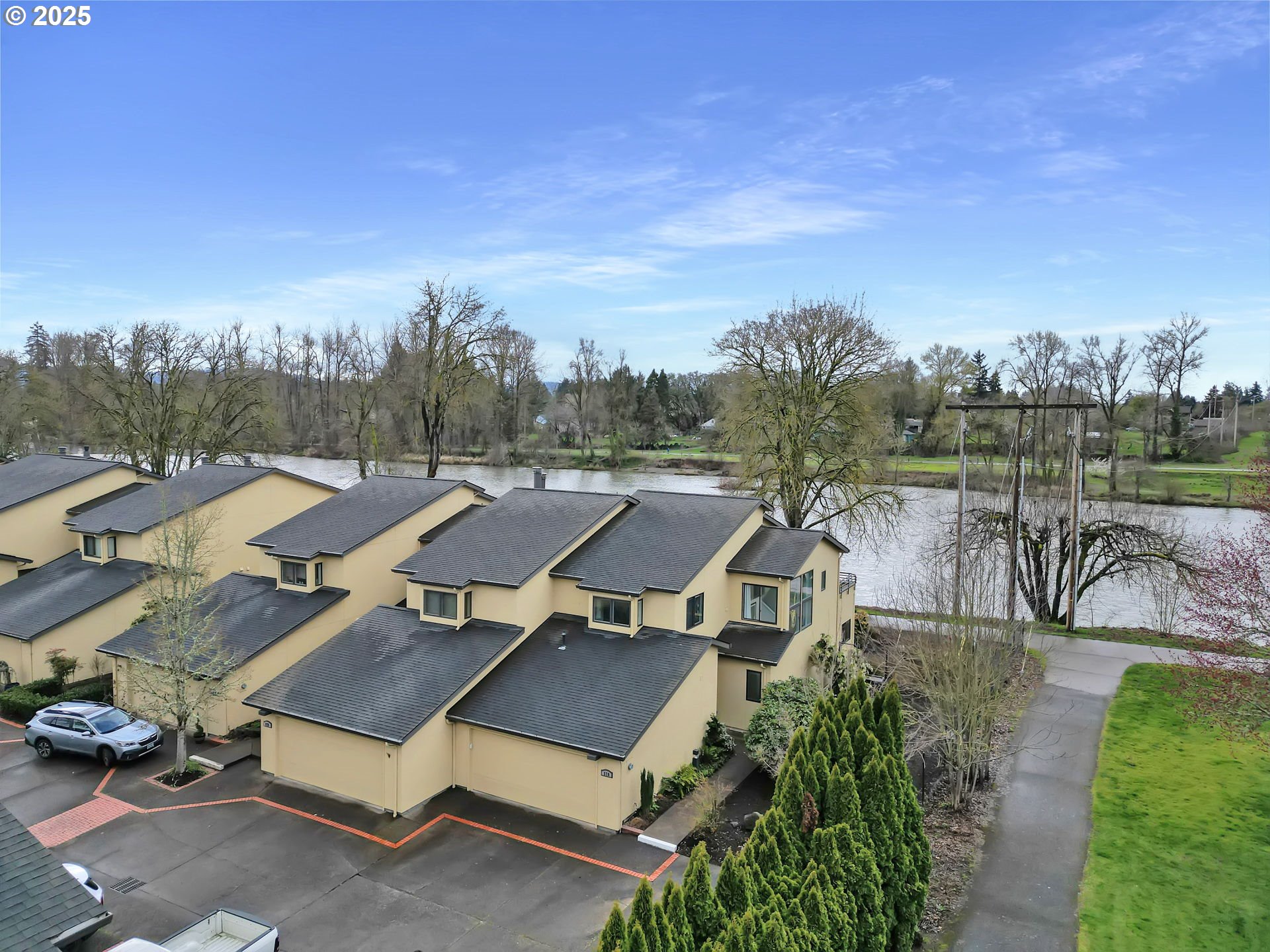 579 Wimbledon Court Eugene, OR 97401 - Photo 6 of 46 an aerial view of a house with a garden and trees