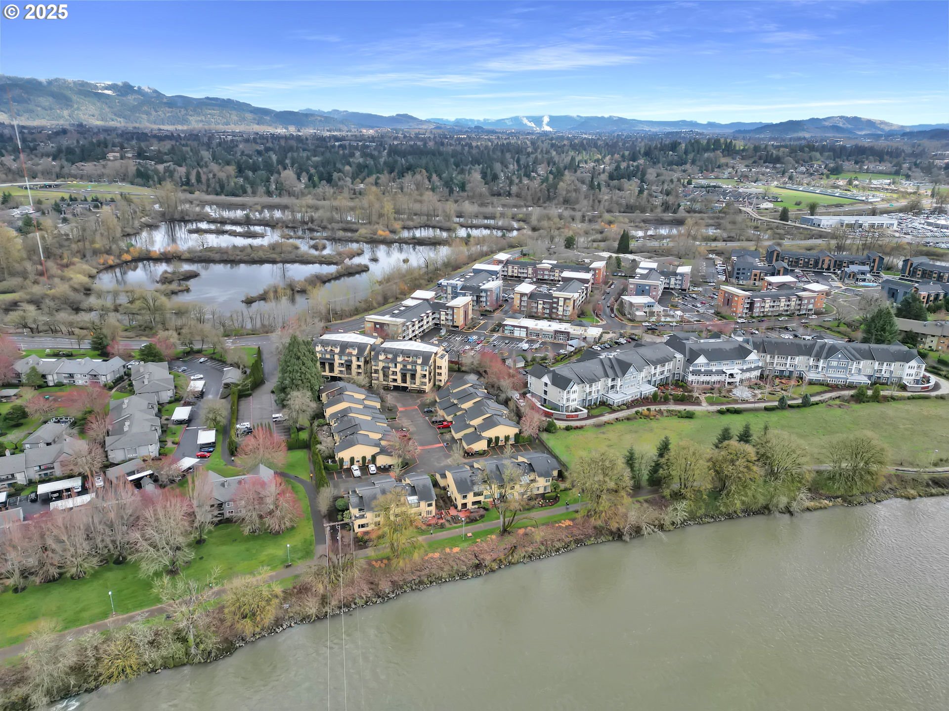 579 Wimbledon Court Eugene, OR 97401 - Photo 9 of 46 an aerial view of residential houses with outdoor space and lake view
