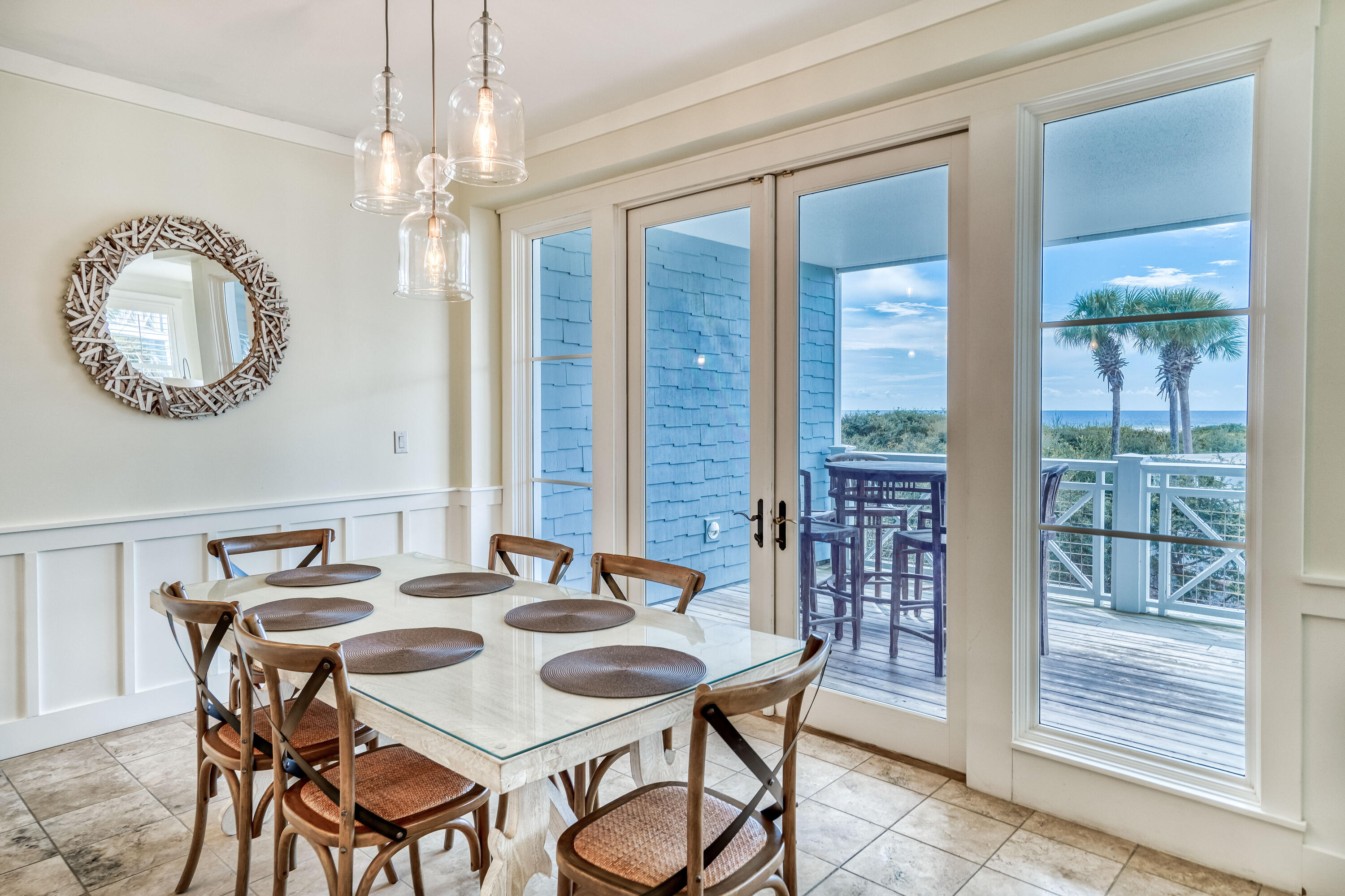 100 Bridge Lane, Unit C112 Watersound, FL 32461 - Photo 14 of 43 a dining room with furniture a chandelier and a rug