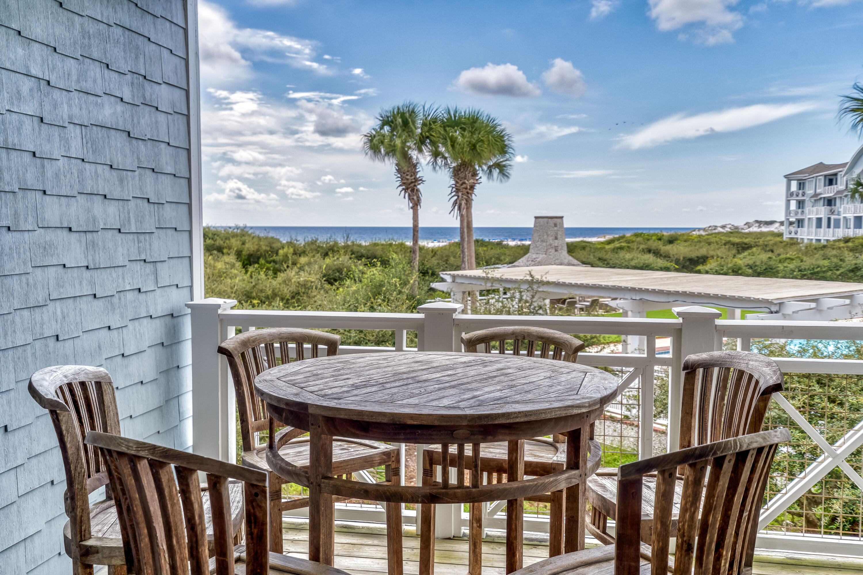 100 Bridge Lane, Unit C112 Watersound, FL 32461 - Photo 18 of 43 a view of a balcony dining area with furniture window and outside view