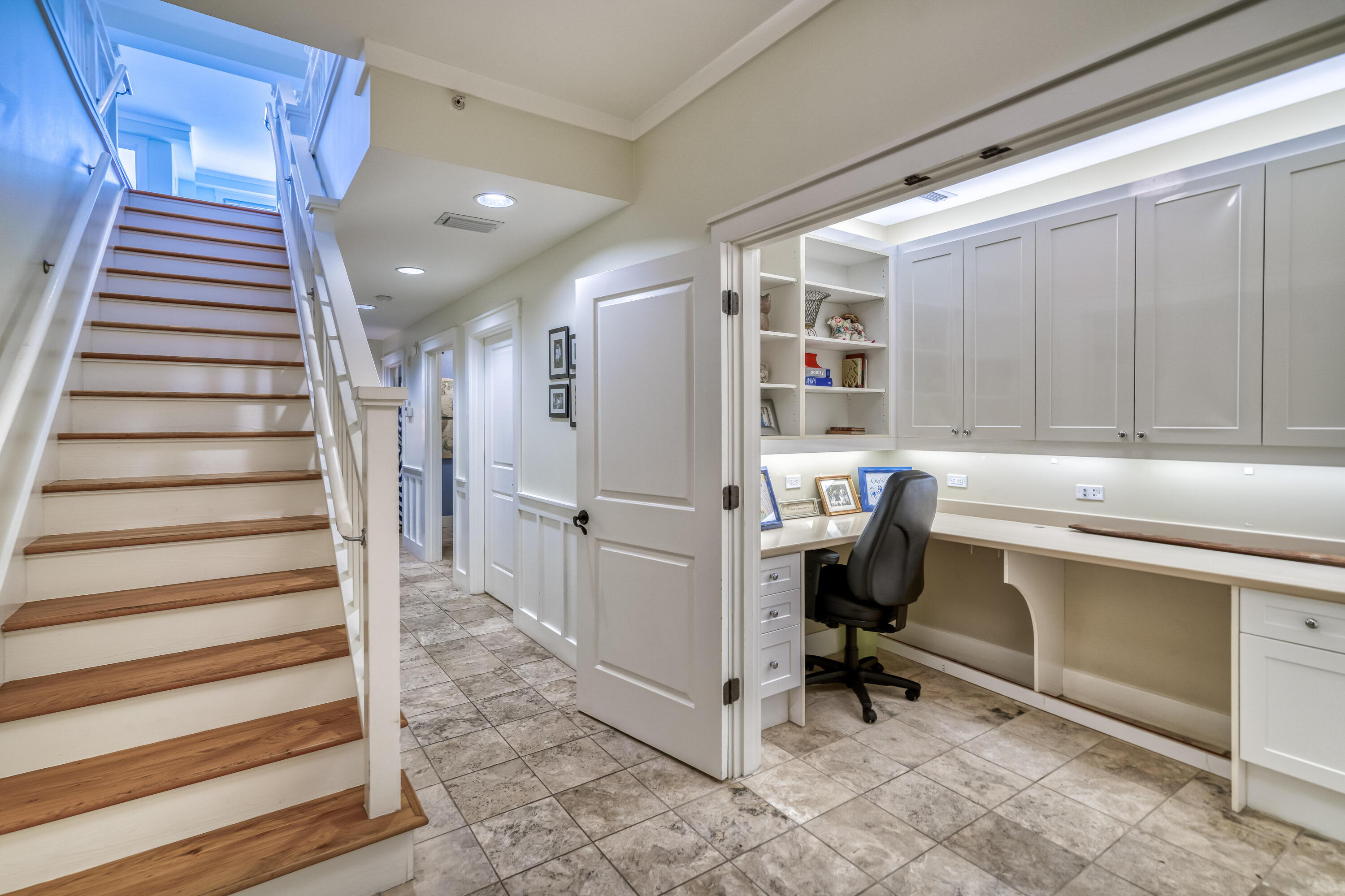 100 Bridge Lane, Unit C112 Watersound, FL 32461 - Photo 21 of 43 a room with a chair and white walls