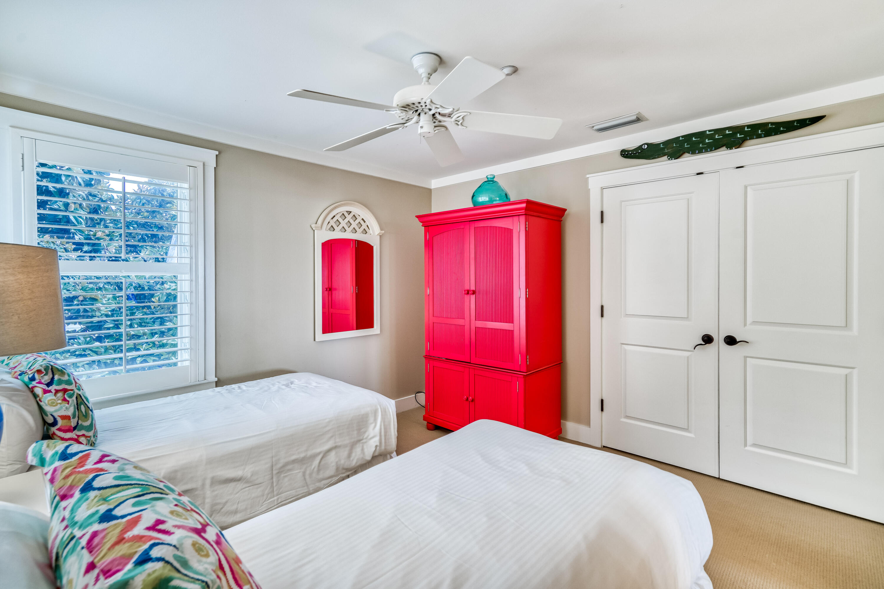100 Bridge Lane, Unit C112 Watersound, FL 32461 - Photo 29 of 43 a bedroom with a bed and a chandelier