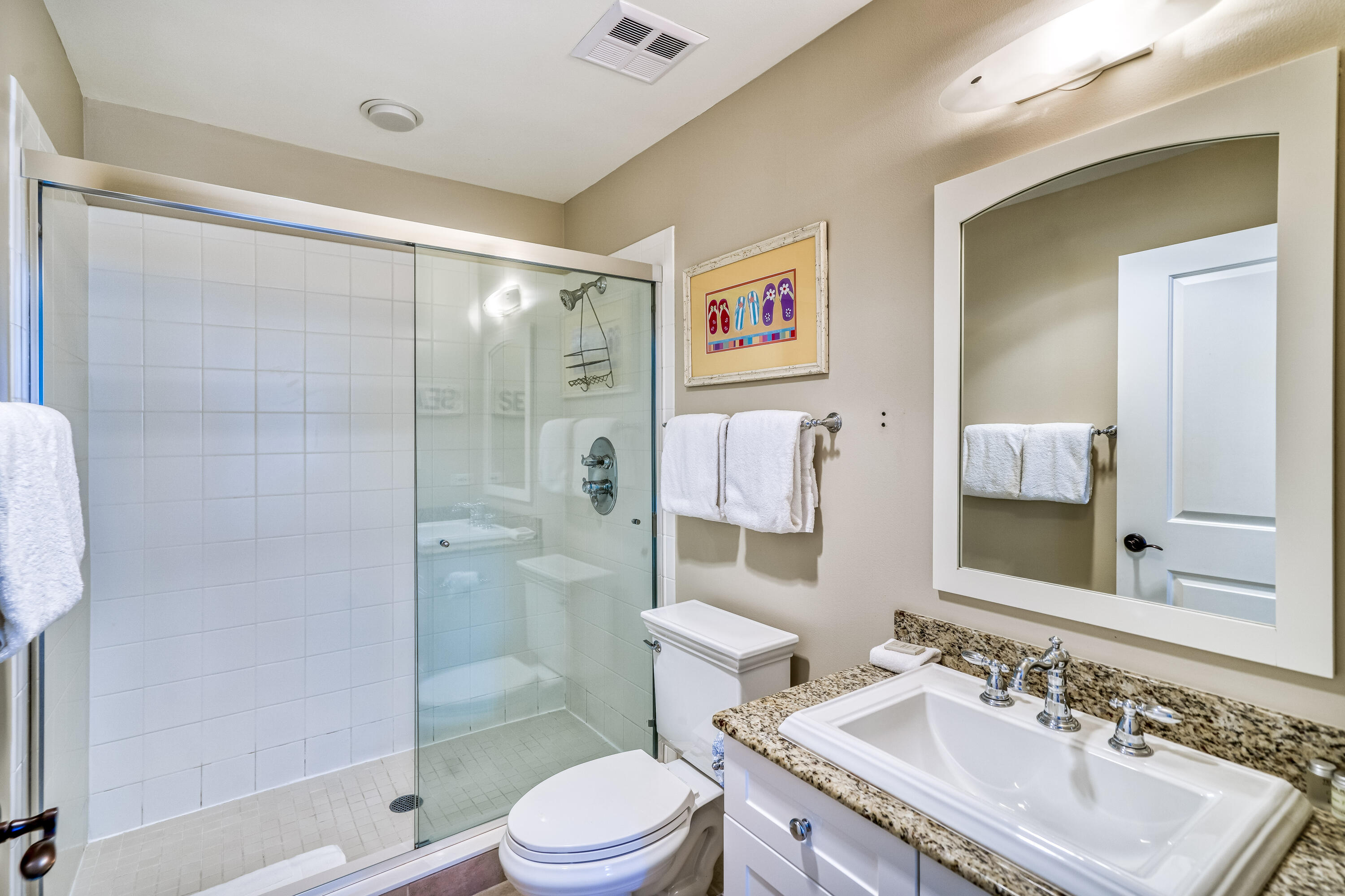 100 Bridge Lane, Unit C112 Watersound, FL 32461 - Photo 31 of 43 a bathroom with a granite countertop sink toilet and shower