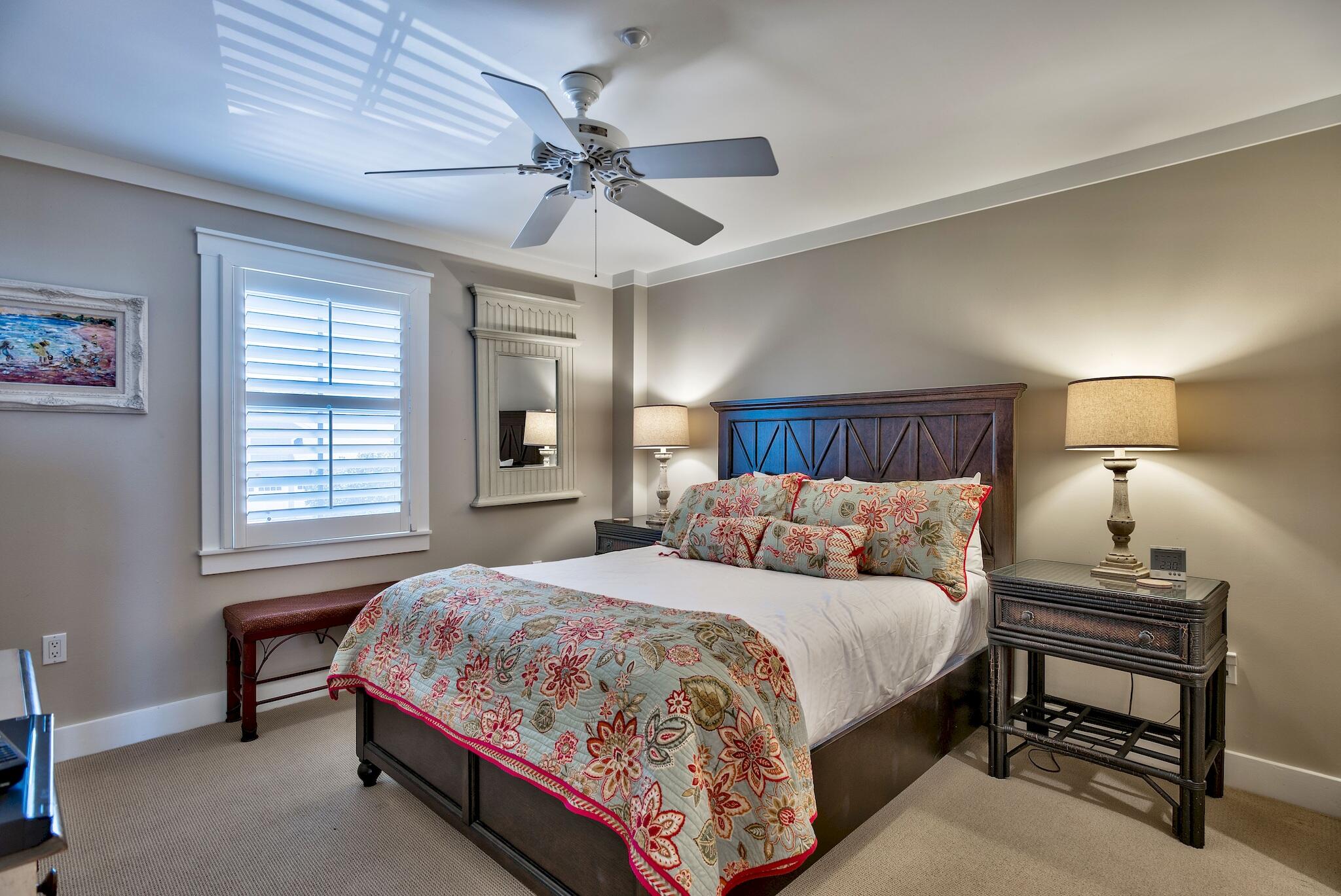 100 Bridge Lane, Unit C112 Watersound, FL 32461 - Photo 32 of 43 a bedroom with a bed and a chandelier