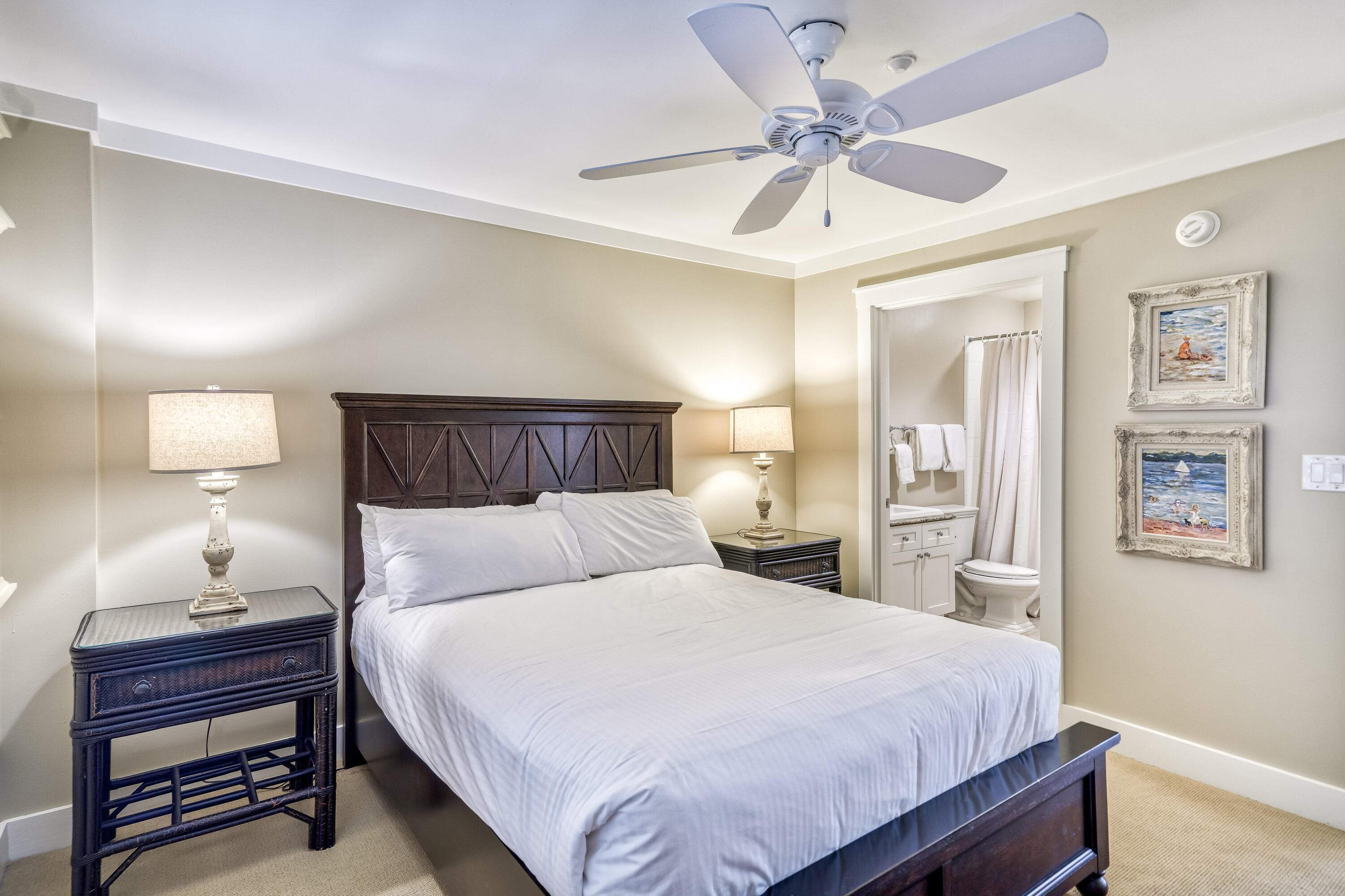 100 Bridge Lane, Unit C112 Watersound, FL 32461 - Photo 33 of 43 a bedroom with a bed and a lamp