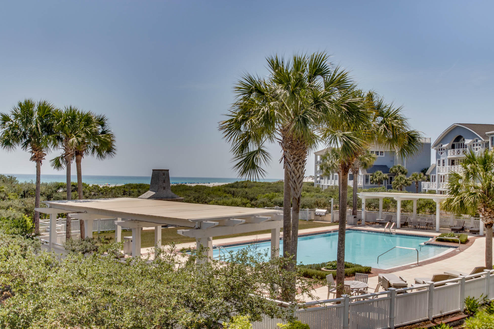 100 Bridge Lane, Unit C112 Watersound, FL 32461 - Photo 36 of 43 a view of a backyard with plants and palm tree