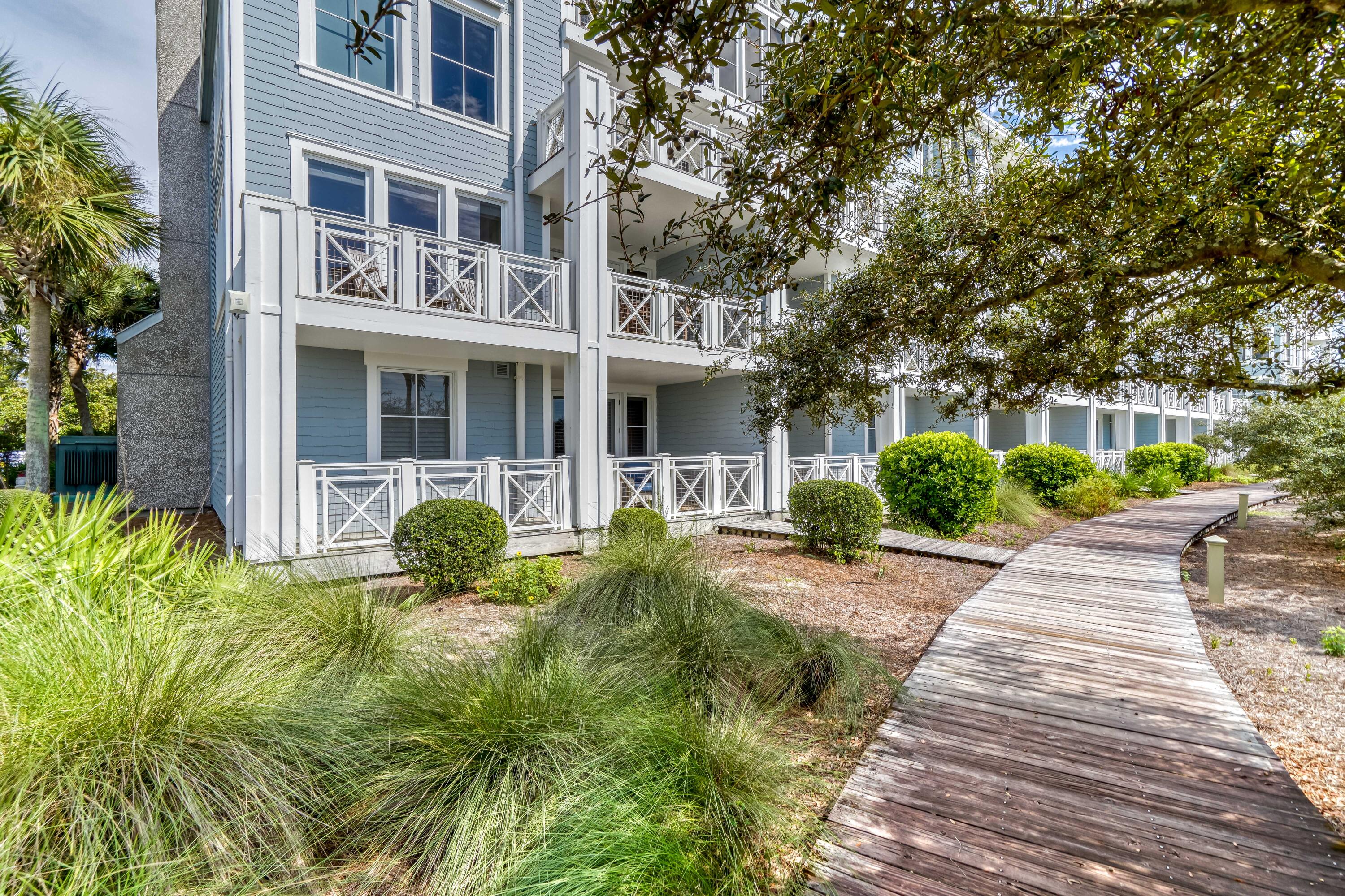 100 Bridge Lane, Unit C112 Watersound, FL 32461 - Photo 5 of 43 a front view of house and yard with green space