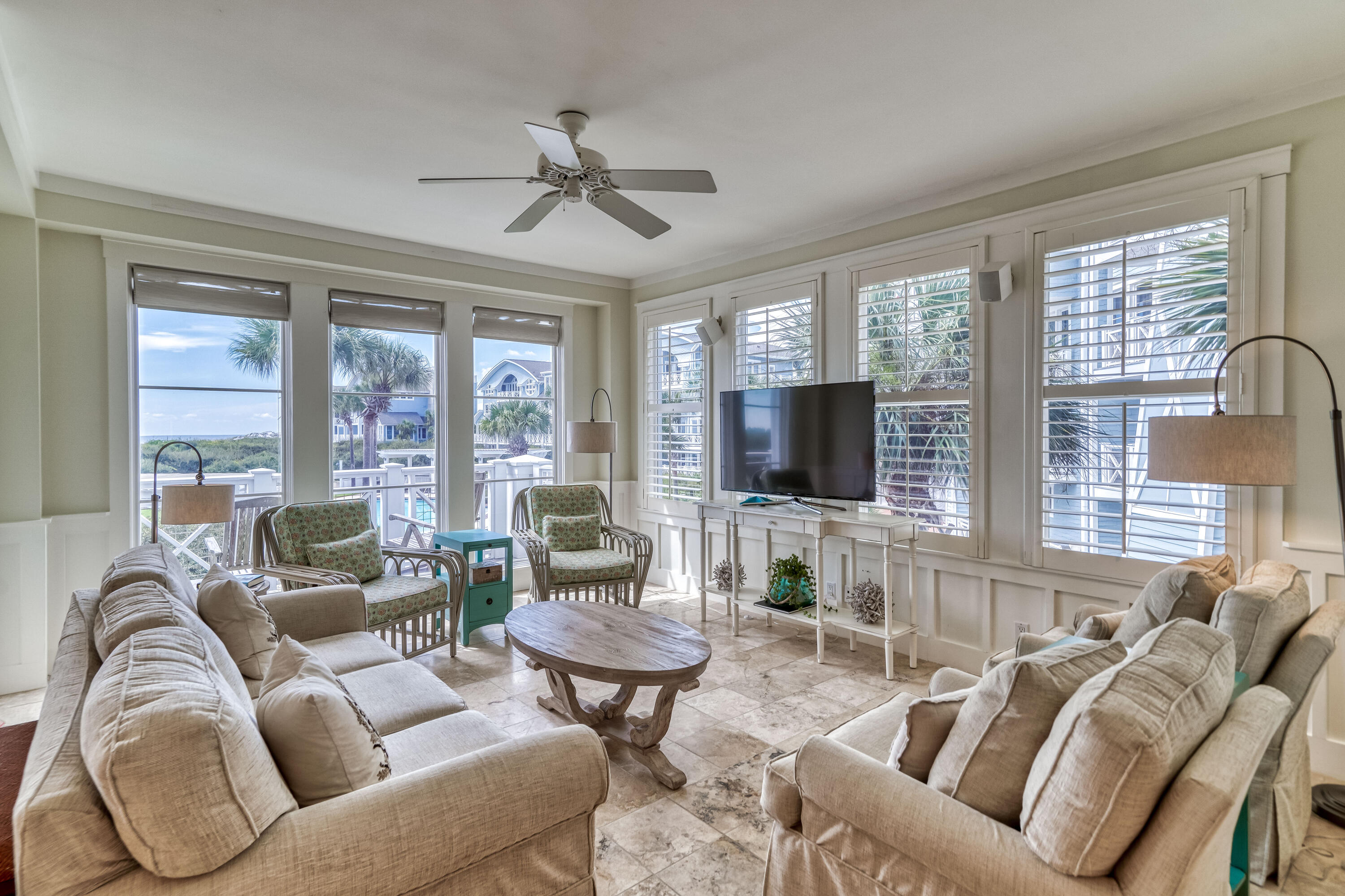 100 Bridge Lane, Unit C112 Watersound, FL 32461 - Photo 8 of 43 a living room with furniture a flat screen tv and large windows