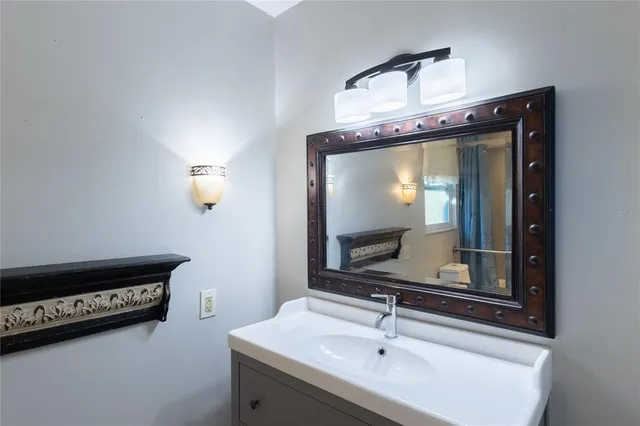 a bathroom with a sink and a mirror