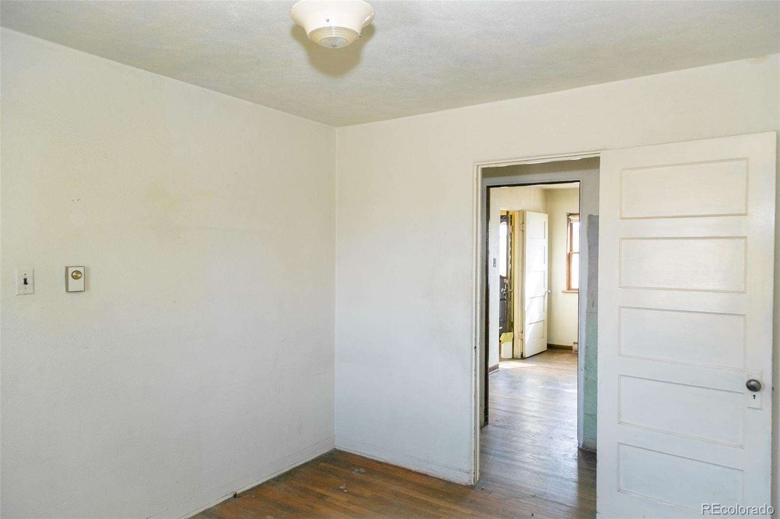 6771 West County Road Del Norte, CO 81132 - Photo 17 of 49 a view of a hallway with wooden floor