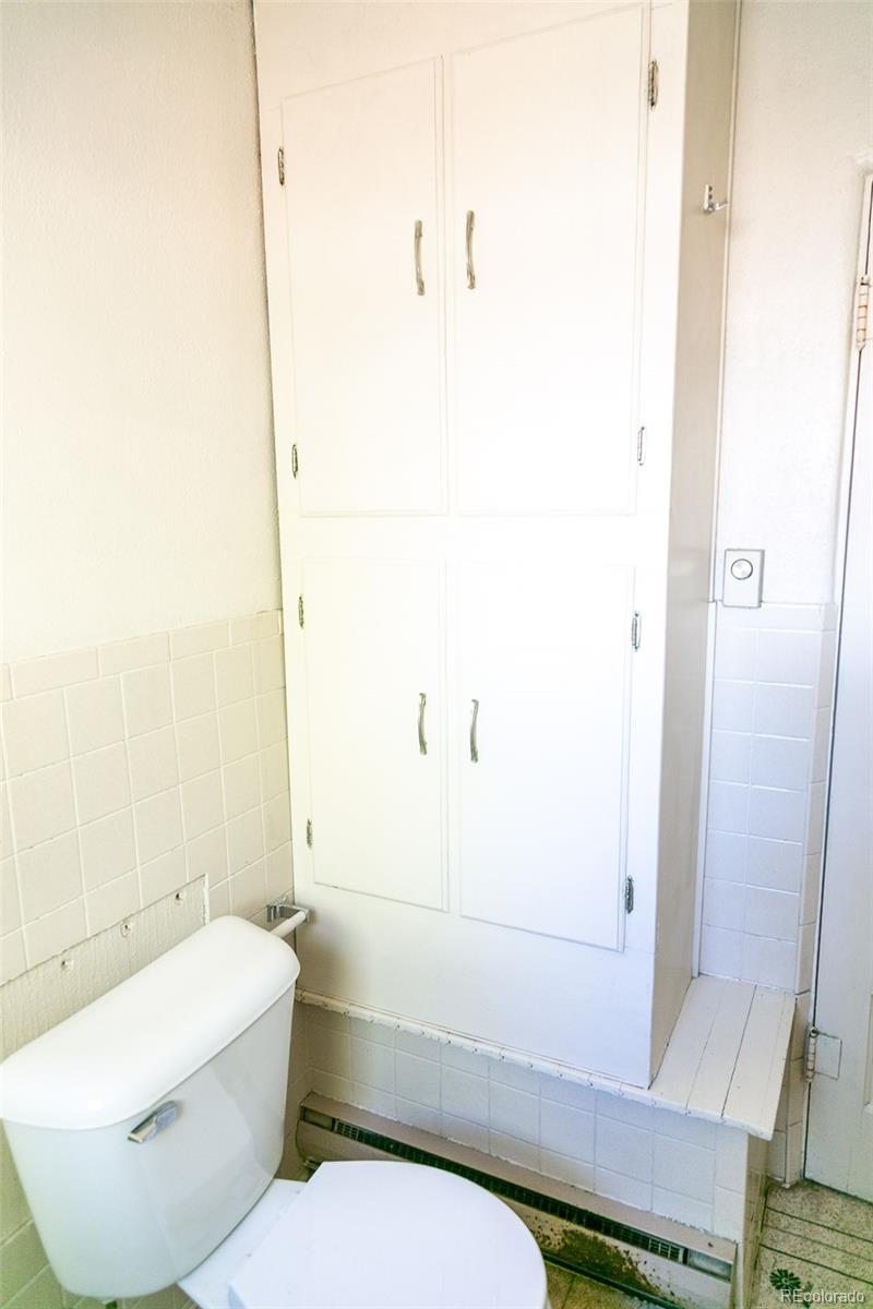 6771 West County Road Del Norte, CO 81132 - Photo 21 of 49 a bathroom with a toilet and a shower