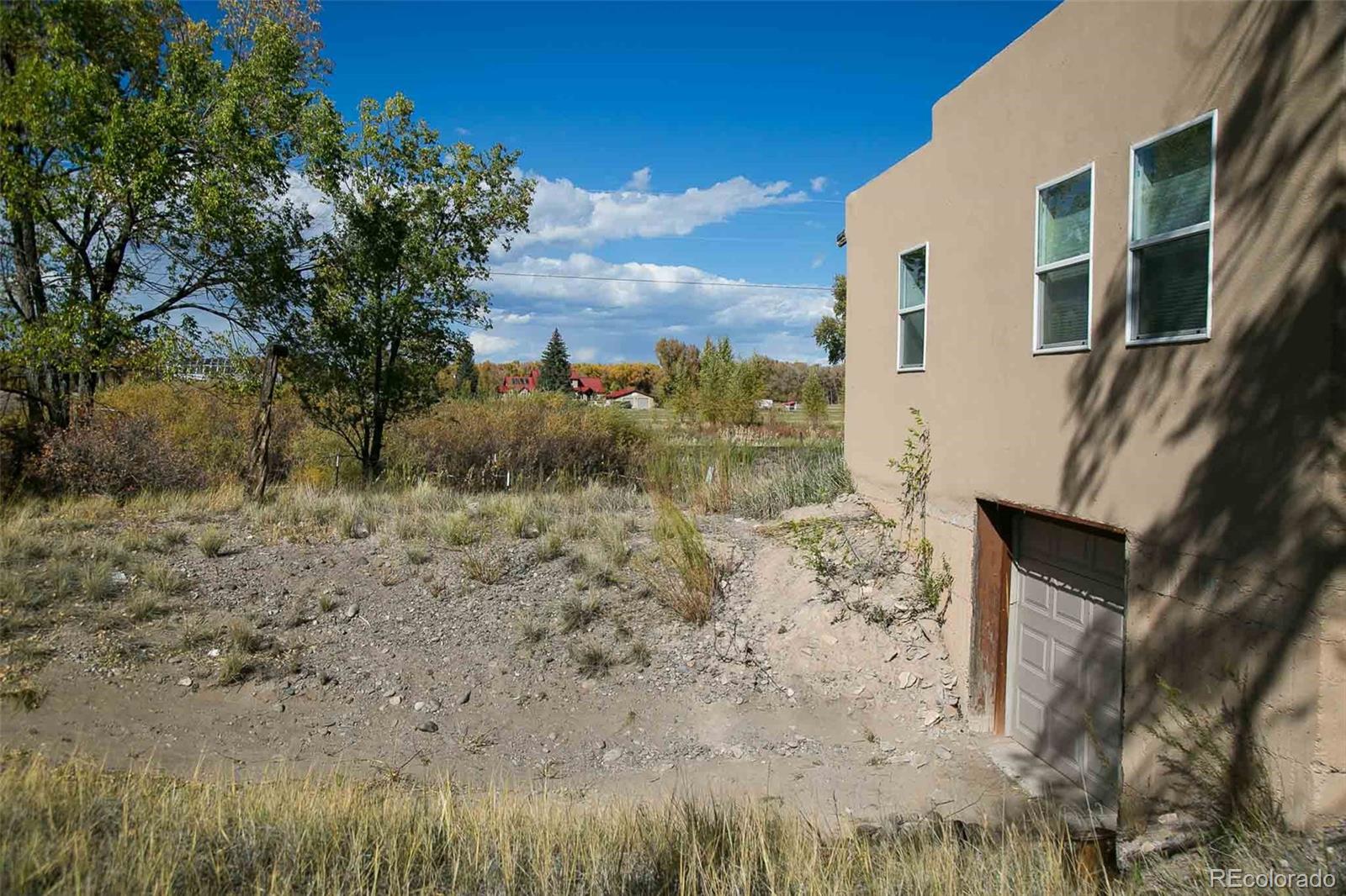6771 West County Road Del Norte, CO 81132 - Photo 31 of 49 a view of a yard with an outdoor space