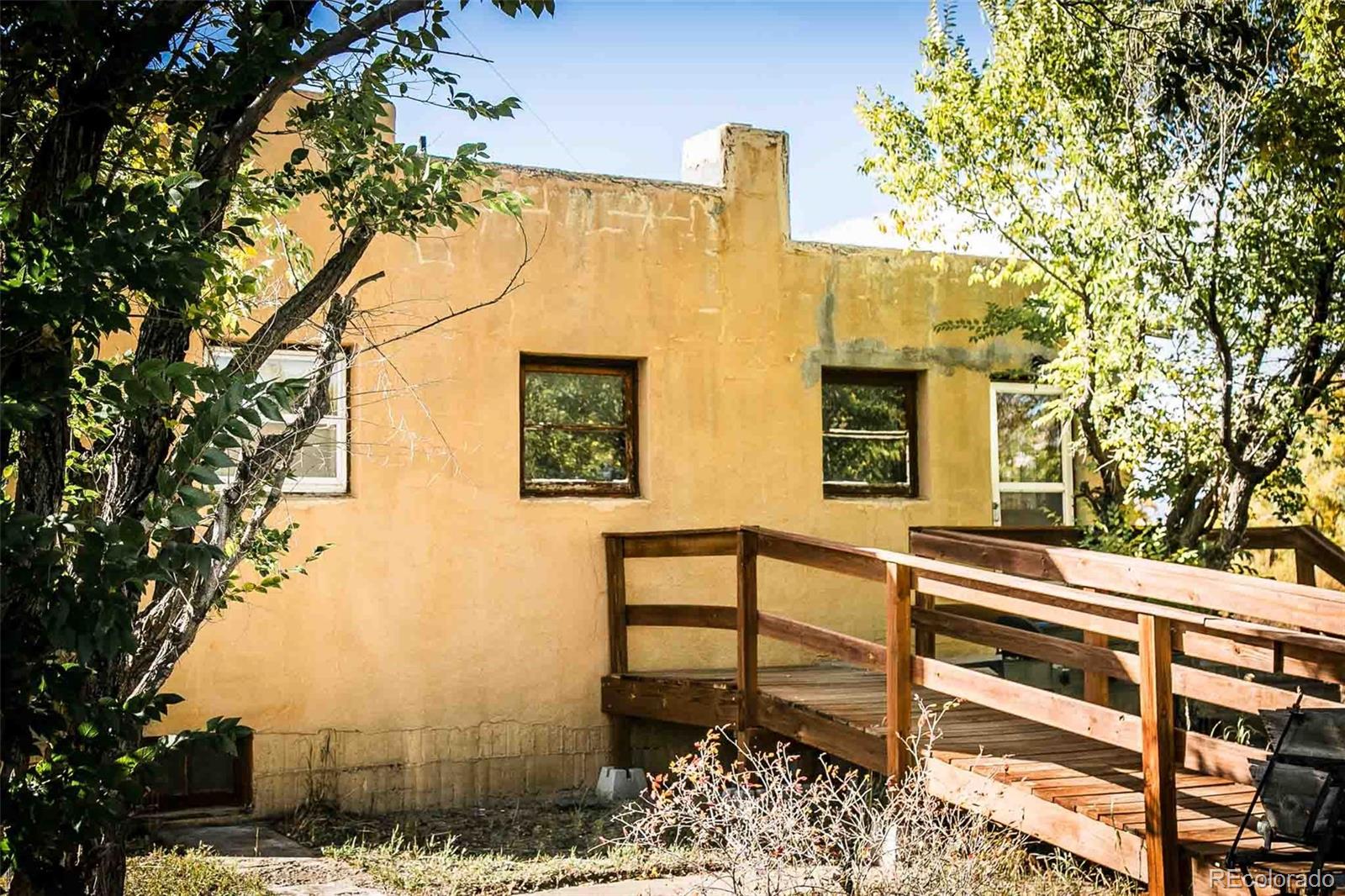6771 West County Road Del Norte, CO 81132 - Photo 34 of 49 a front view of a house with trees