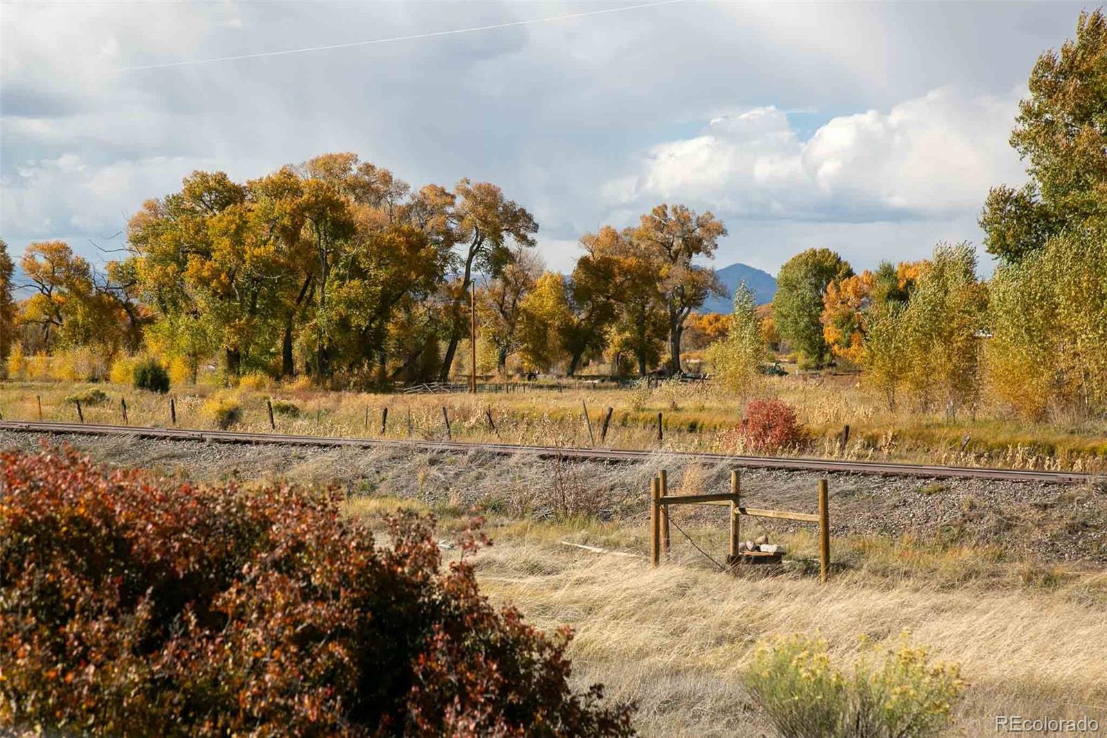 6771 West County Road Del Norte, CO 81132 - Photo 43 of 49 a view of a yard with wooden fence