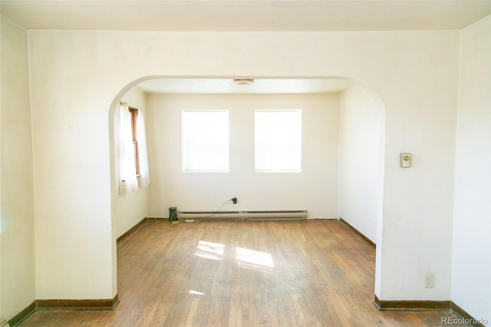6771 West County Road Del Norte, CO 81132 - Photo 7 of 49 a view of a room with wooden floor and a window