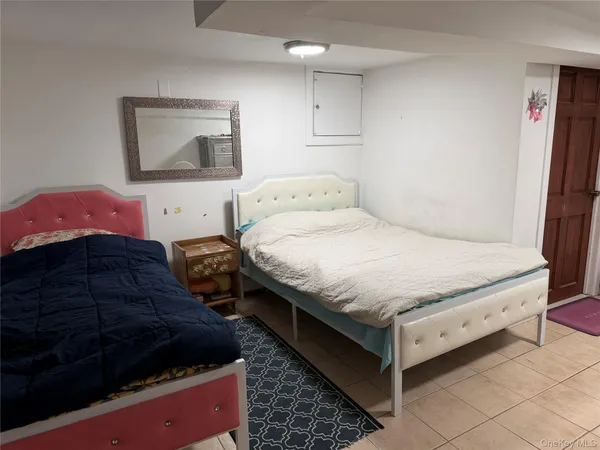 a bedroom with bed and window