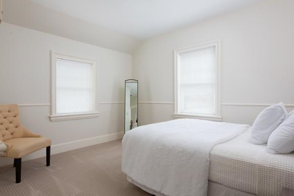118 Marrett Road Lexington, MA 02421 - Photo 24 of 38 a bedroom with a bed and a window