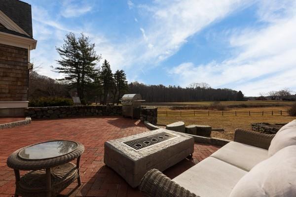 118 Marrett Road Lexington, MA 02421 - Photo 33 of 38 a terrace of a house with outdoor seating