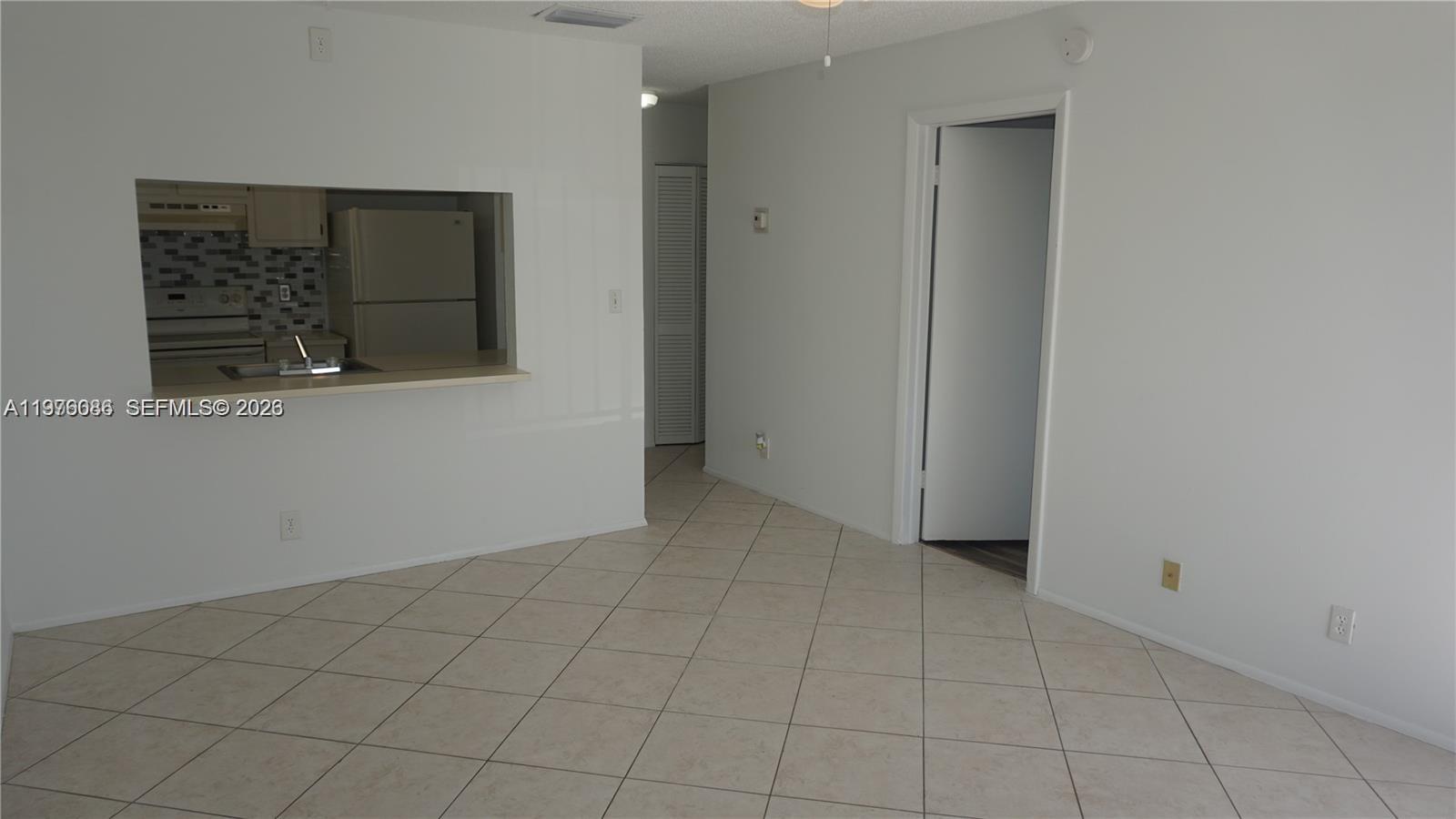 10057 Winding Lake Road, Unit 204 Sunrise, FL 33351 - Photo 4 of 13 Living and Dining Area