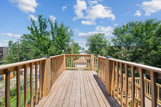 a view of balcony with wooden floor