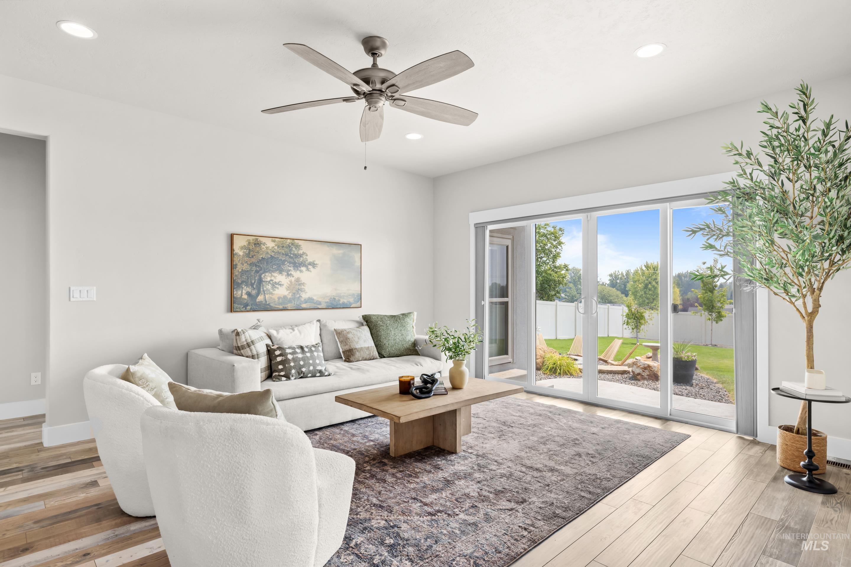 7691 West Hill Road Boise, ID 83714 - Photo 6 of 39 Living area featuring wood-finish flooring, recessed lighting, and a ceiling fan