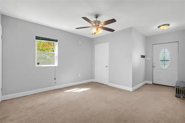 a view of an empty room with a window