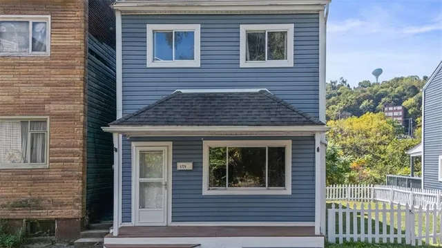 a front view of a house with a porch