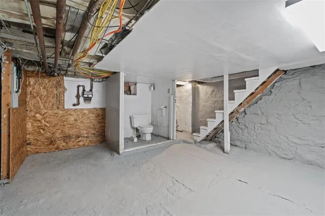 a view of an empty room with stairs