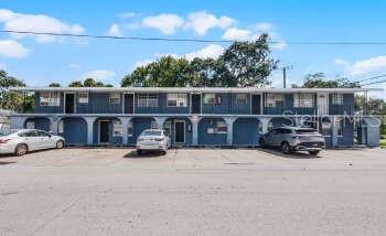 601 State Avenue, Unit 6 Daytona Beach, FL 32117 - Photo 1 of 7 a view of a car parked in garage yard