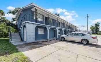 a car parked in front of a house
