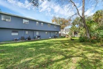 601 State Avenue, Unit 6 Daytona Beach, FL 32117 - Photo 7 of 7 a front view of house with yard and trees in the background