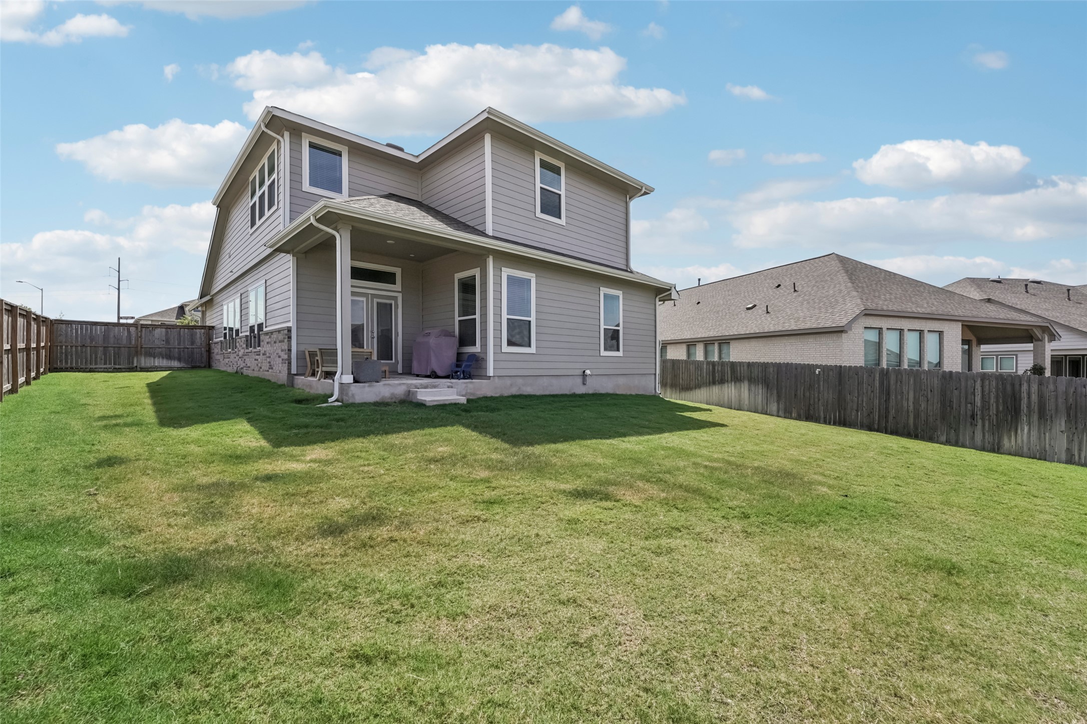 1108 Sweetspire Street Leander, TX 78641 - Photo 35 of 39 Rear view of property with a fenced backyard and a patio