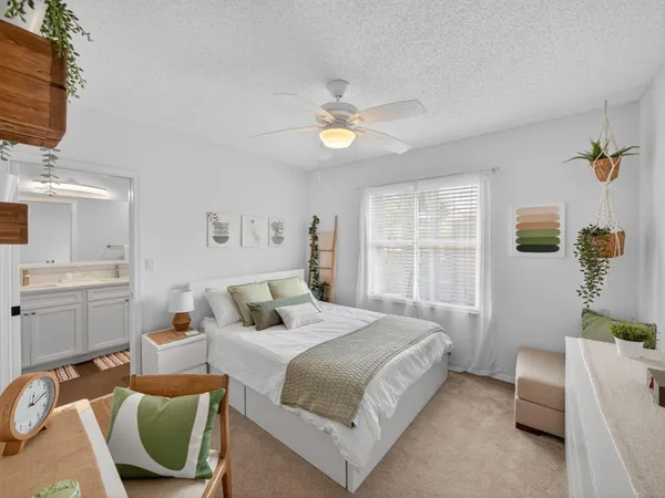 a bed room with a bed and a window