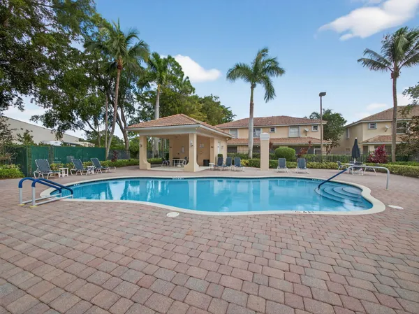 a view of a swimming pool with a patio