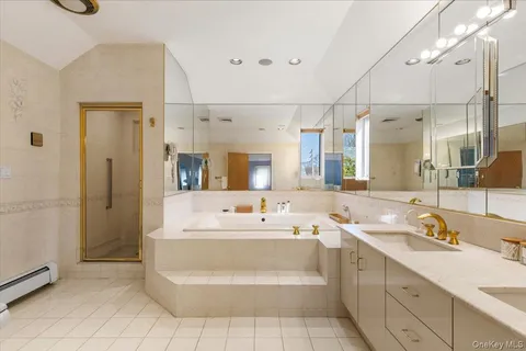 a bathroom with a double vanity sink mirror and double