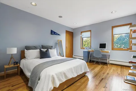 a bed room with a bed and a window