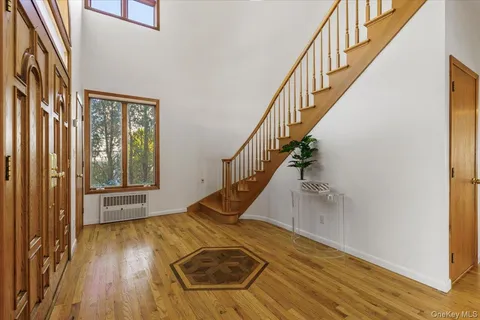a living room with furniture a fireplace and a window