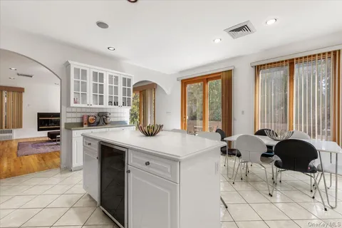 a view of kitchen with cabinets and outdoor space