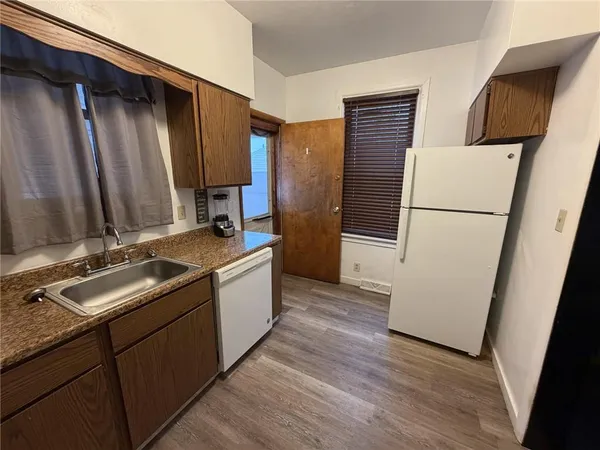 a bathroom with a double vanity sink and mirror