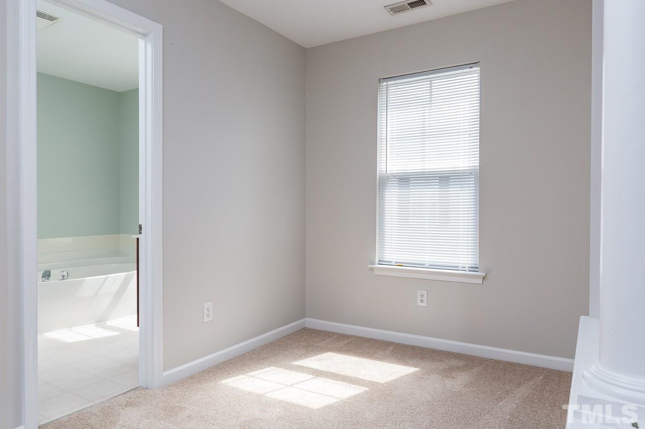 8485 Central Drive Raleigh, NC 27613 - Photo 12 of 25 an empty room with windows