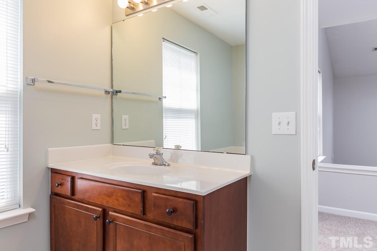 8485 Central Drive Raleigh, NC 27613 - Photo 15 of 25 a sink with a vanity