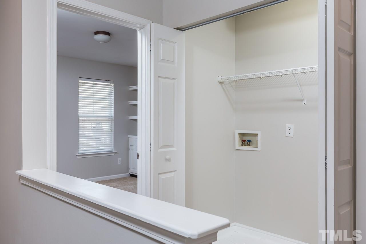 8485 Central Drive Raleigh, NC 27613 - Photo 19 of 25 a bathroom with a bathtub and a shower