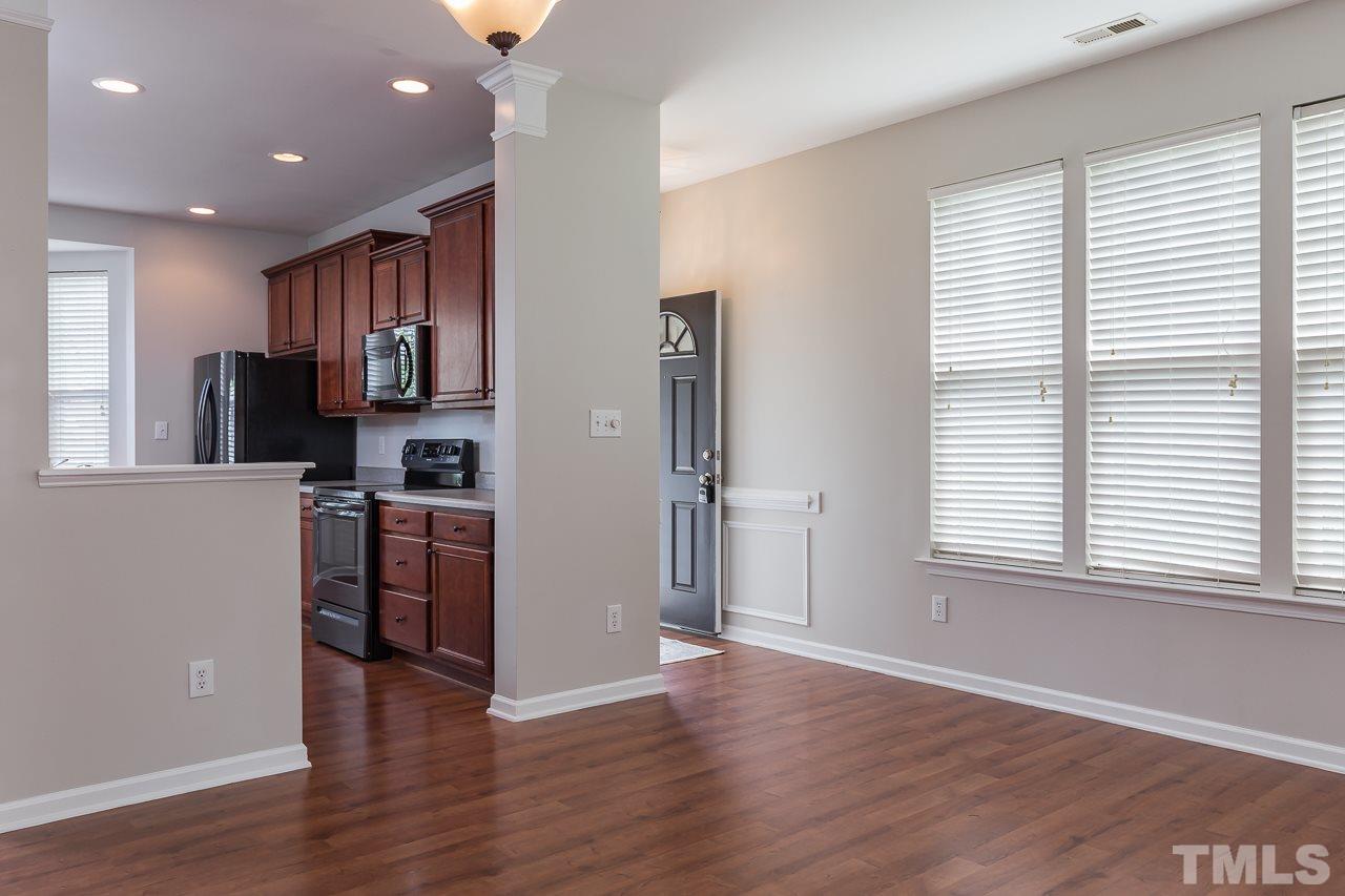 8485 Central Drive Raleigh, NC 27613 - Photo 6 of 25 a view of kitchen with stainless steel appliances granite countertop a refrigerator and a stove top oven